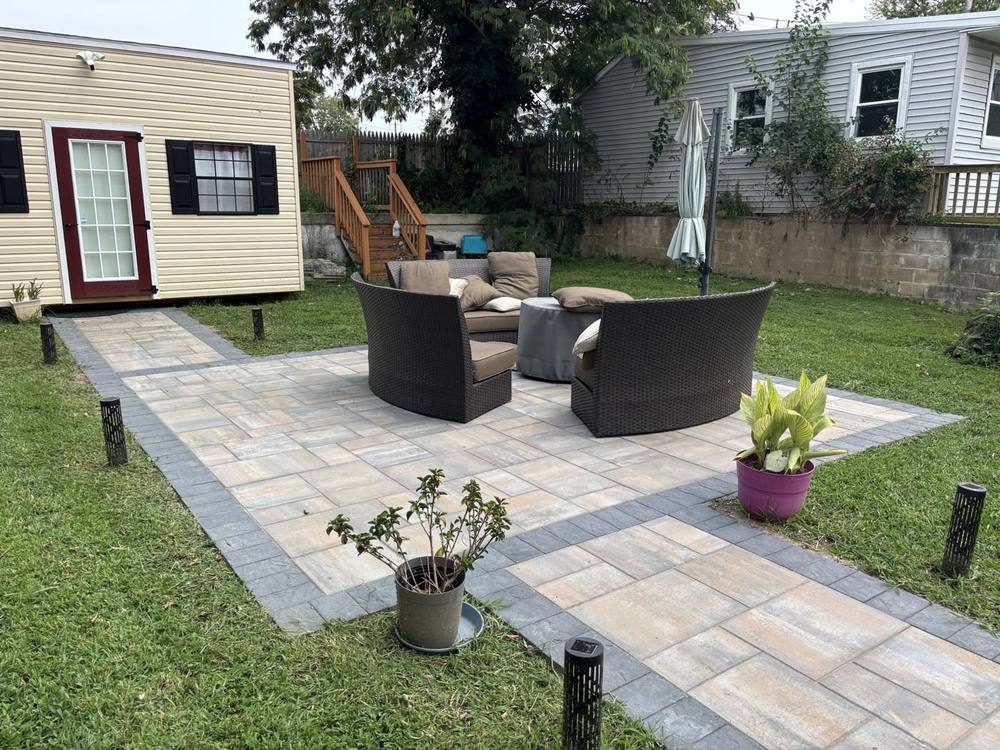 Finished paver patio and walkway surrounded by new lawn