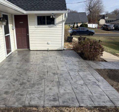 Gray stamped concrete patio in an ashlar pattern